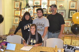 Dani with parents and brother Liam at Thursday's signing.